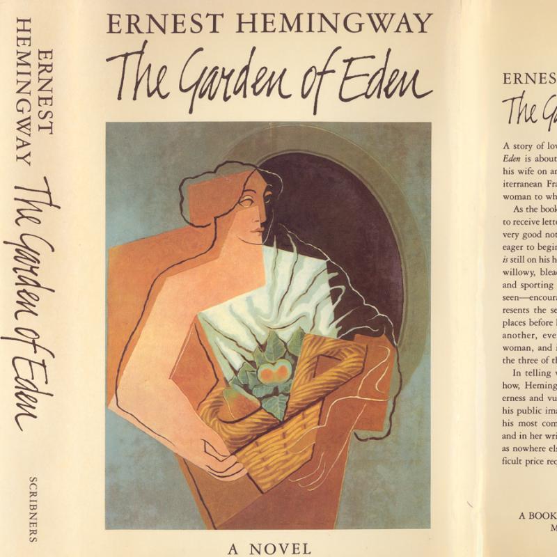 A scan of the 1st edition dustjacket for Hemingway's The Garden of Eden.  The author's name and title are in black text on pale beige; the cover features a stylized image of a person holding a basket.  The words "A Novel" appear in black text along the bottom edge.