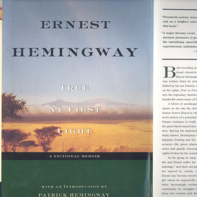 A scan of the 1st edition dustjacket from Hemingway's True at First Light.  The cover features a photograph of Mt. Kilimanjaro and another of game on a trail.  The author's name appears in black over the sky; the title appears in white over the mountain and the plains.  A black bar runs beneat the photos, containing the text "A Fictional Memoir" in white.  The bottom of the cover is a band of green, with white text reading "With an introduction by Patrick Hemingway."