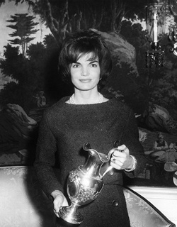 JFKWHP-AR6933-A. First Lady Jacqueline Kennedy Holds Silver Pitcher, 5 December 1961