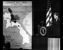 JFKWHP-AR6454-B. President John F. Kennedy at Press Conference; map of Laos at left reads, "Communist Rebel Areas, 22 March 1961," 23 March 1961