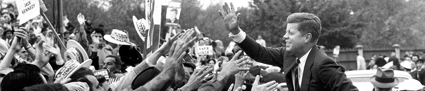 JFK waves to a crowd