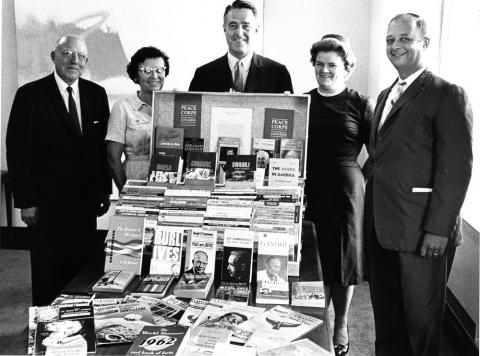 JFKPOF-086-002-p0045: Sargent Shriver and Others Examine Books for Peace Corps Volunteers, 1962 