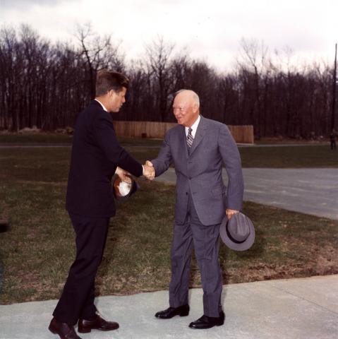 KN-C17598 President Kennedy greets President Eisenhower at Camp David, 22 April 1961.