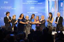 The 5 Sister Senators hold the Profile in Courage Award lantern. They are flanked by Jack Schlossberg and Ambassador Caroline Kennedy on the left and Tatiana Schlossberg and Ed Schlossberg on the right