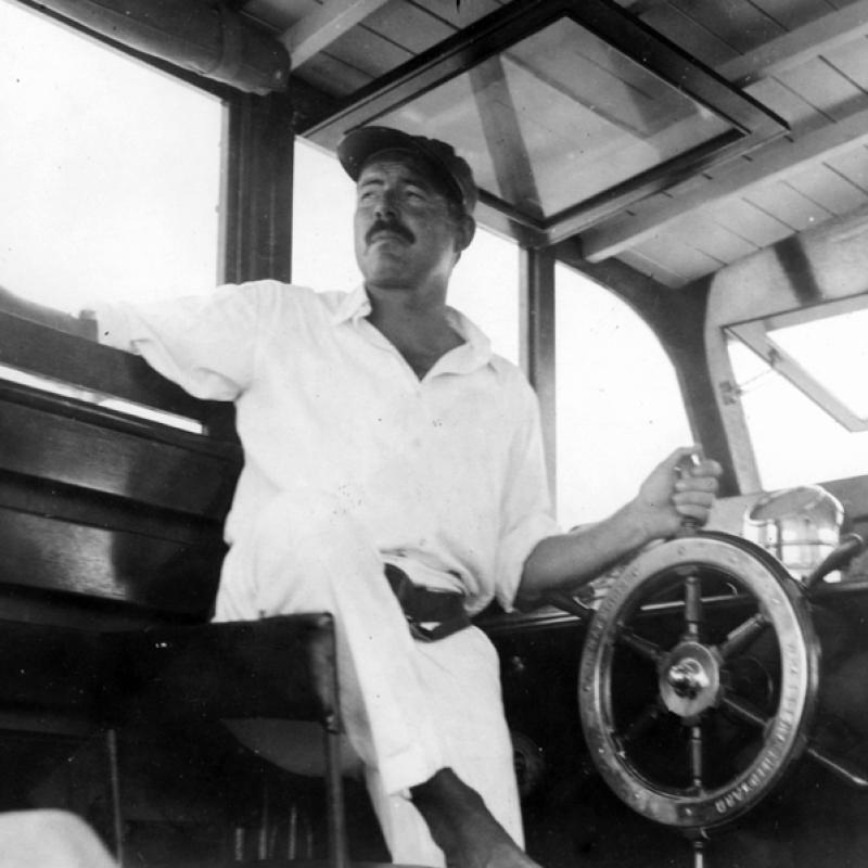 Detail of photograph of Ernest Hemingway at the helm of the Pilar, c. 1930s